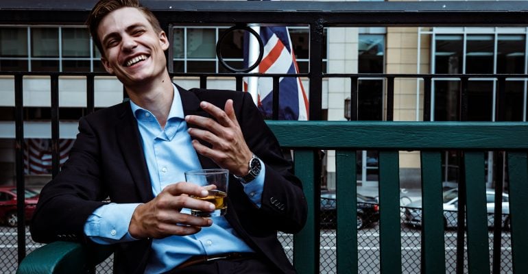 The Charm Of British Accents Why They Enhance Your Brands Voice Young British Man With Whiskey 770x400